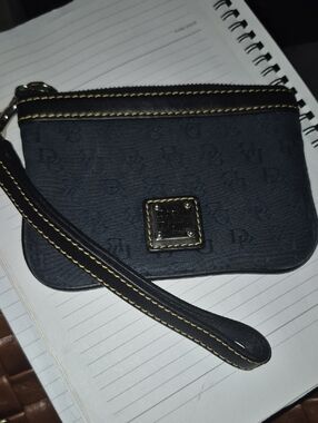 Dooney & Bourke Black Wristlet with Yellow Stitching Accent